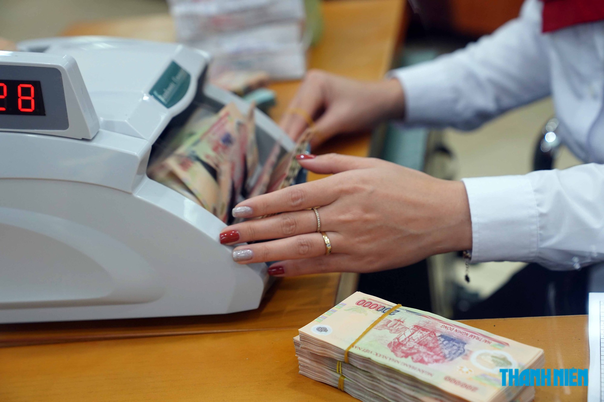 Thêm nhiều ngân hàng giảm lãi suất cho vay- Ảnh 1.