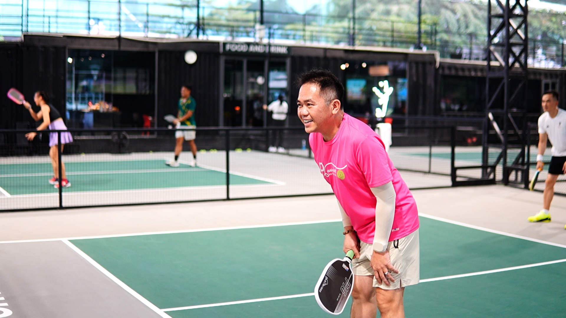 Tony Hoang and actor Chi Bao in action at the pickleball tournament.
