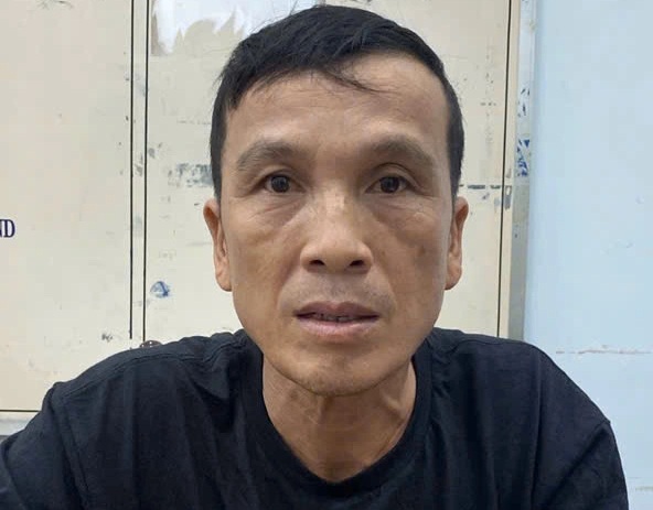 Tội phạm truy nã bị bắt khi đang giao dịch tại ngân hàng - Ảnh 1.
