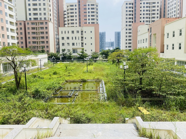 Hé lộ nguyên nhân khu nhà tái định cư hơn 20 năm vẫn chưa hoàn thành - Ảnh 1.