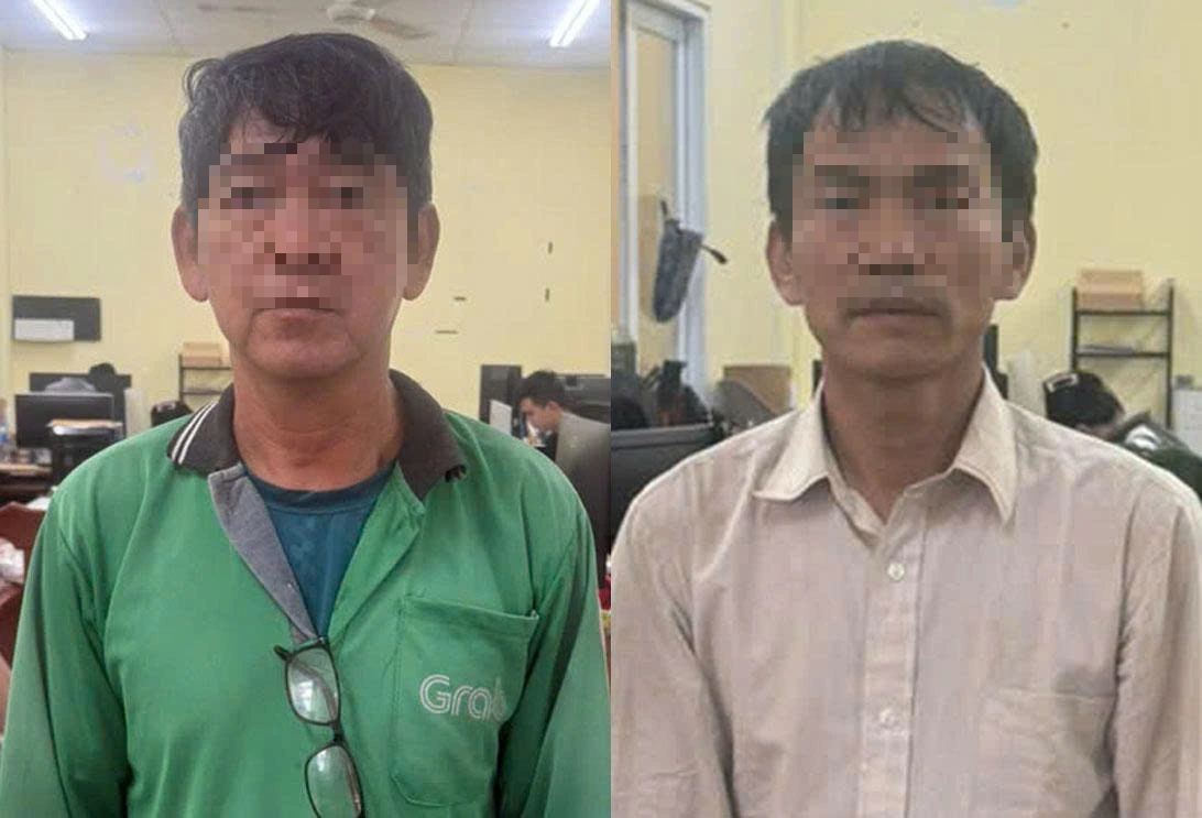 Tạm giam 2 người đàn ông đánh nhau bằng nón bảo hiểm trên đường cộng hòa - Ảnh 1.