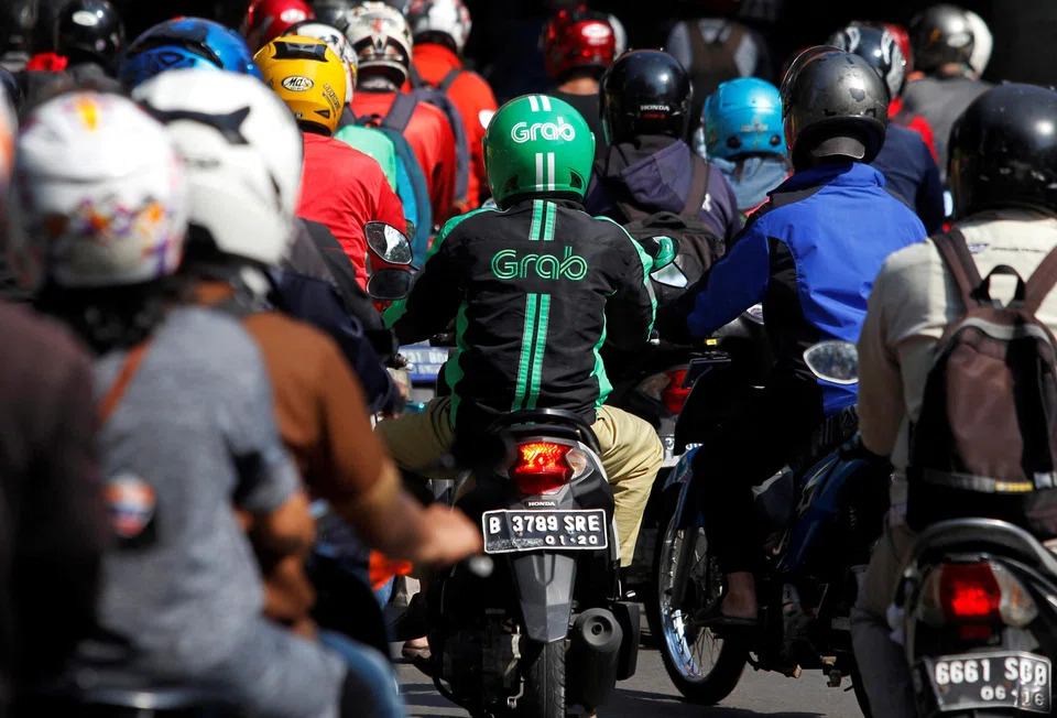 Indonesia siết phí gọi xe, Grab và GoTo chịu áp lực lớn - Ảnh 1.