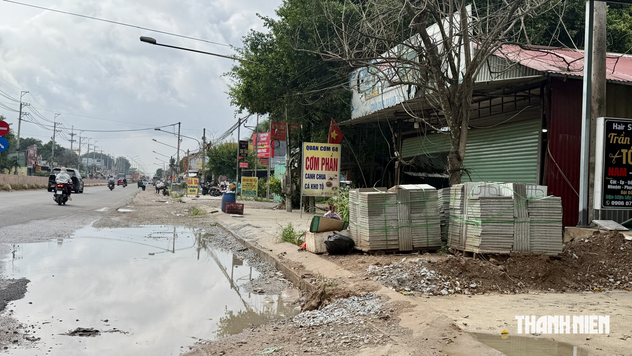 Người dân TP.HCM nhận hỗ trợ giải tỏa đường ĐT.744 do chậm trả, cao nhất 620 triệu - Ảnh 2.