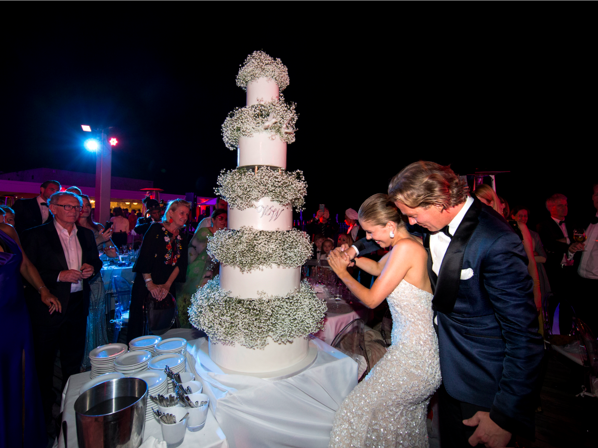 the-newlyweds-cut-a-five-tier-cake.jpg