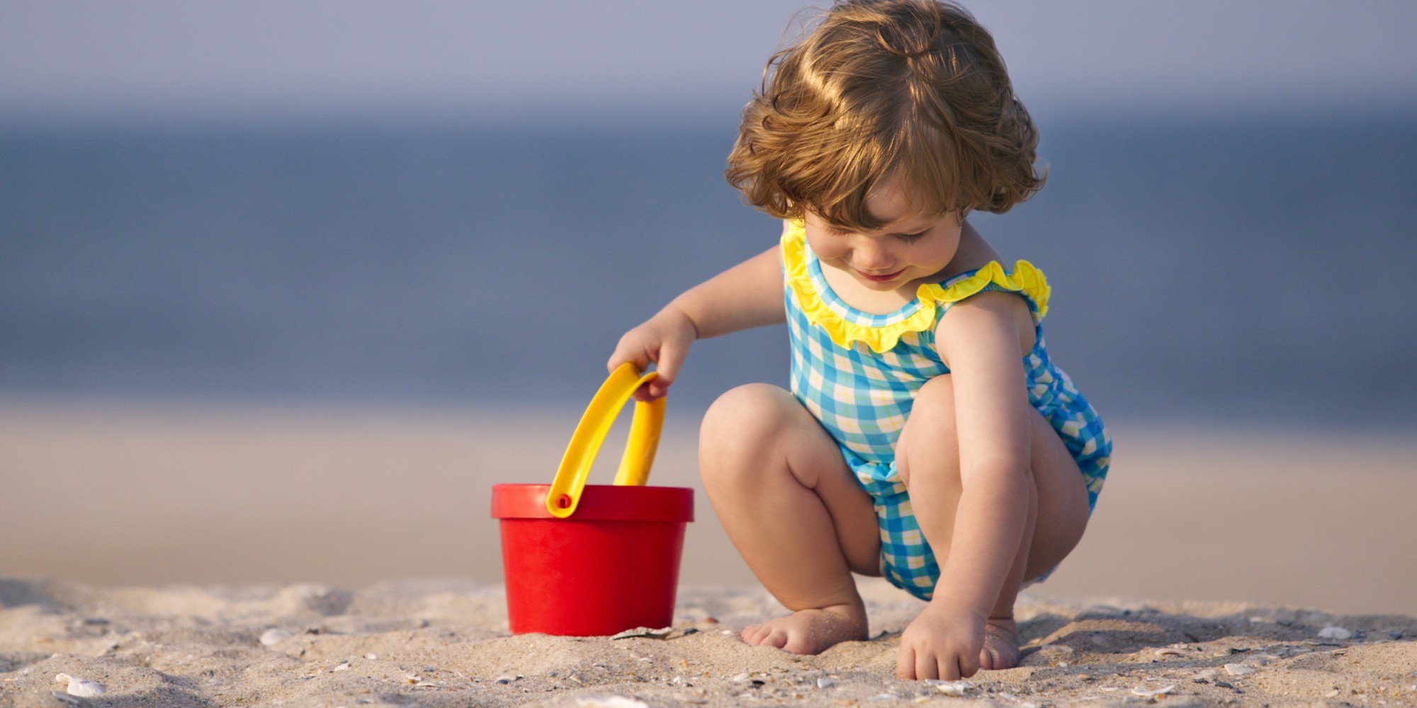 o-TODDLER-PLAYING-IN-SAND-facebook