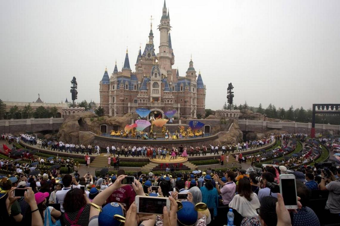Performers take to the stage during the opening ceremony for the Disney Resort in Shanghai