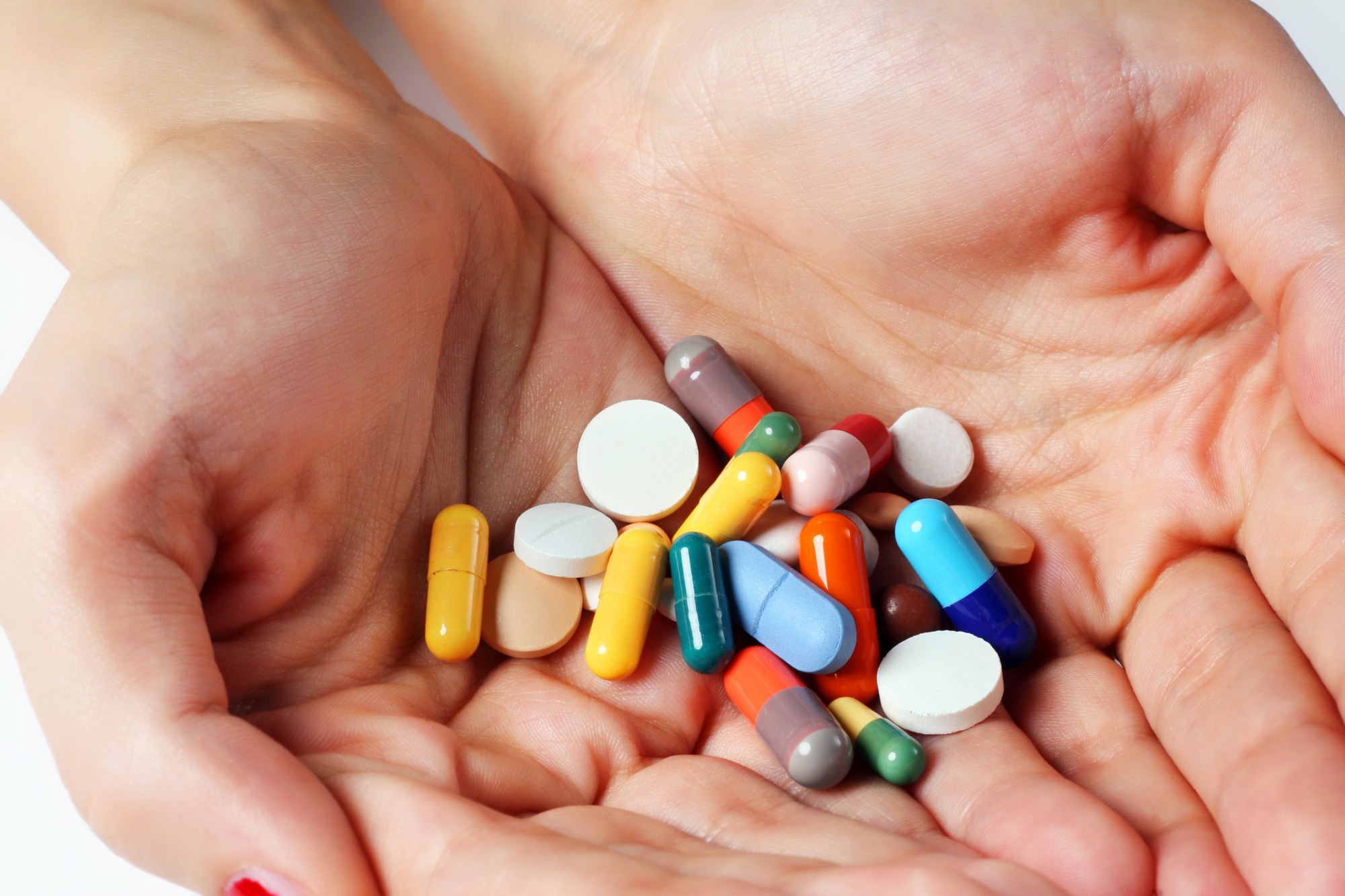 bigstock-Pills-In-Hand-50162660