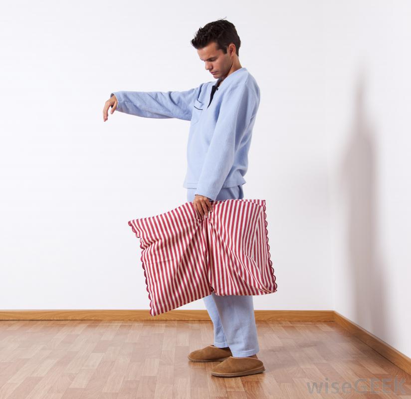 man-in-pajamas-sleepwalking-with-pillow