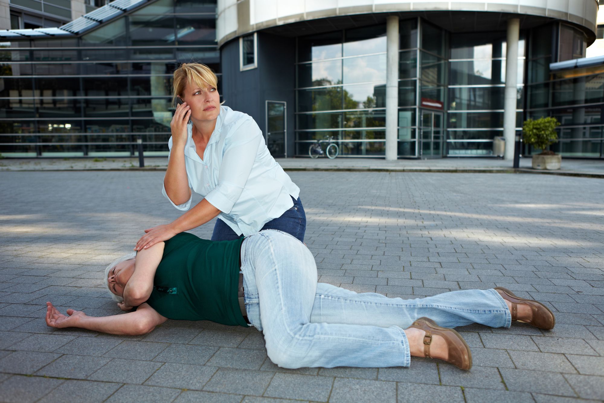 fainting-Passerby-Making-Emergency-Call-23636249
