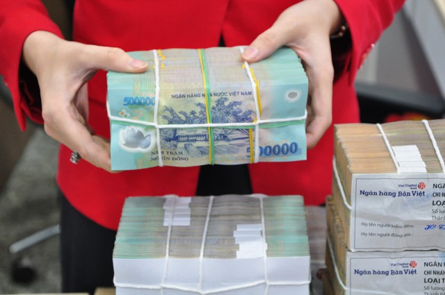 Ngân hàng, kho bạc đảm bảo hoạt động thanh toán vào dịp tết- Ảnh 1. Ngân hàng, kho bạc đảm bảo hoạt động thanh toán vào dịp tết- Ảnh 1.