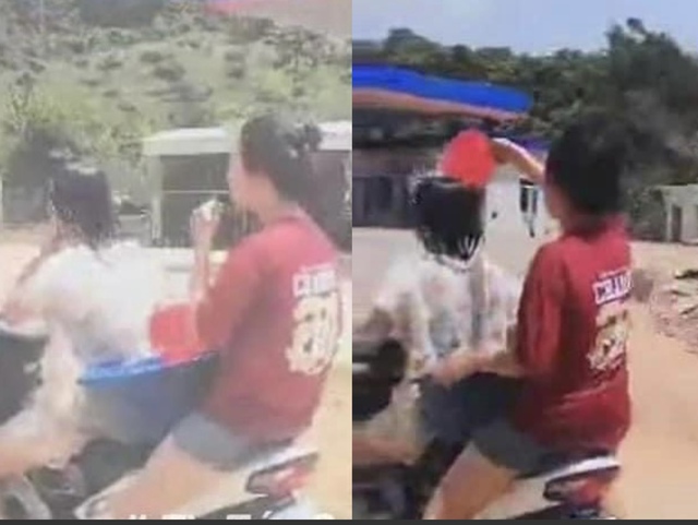 Triệu tập 2 nữ sinh vừa đi xe máy vừa tắm cho nhau trên đường - Ảnh 1.