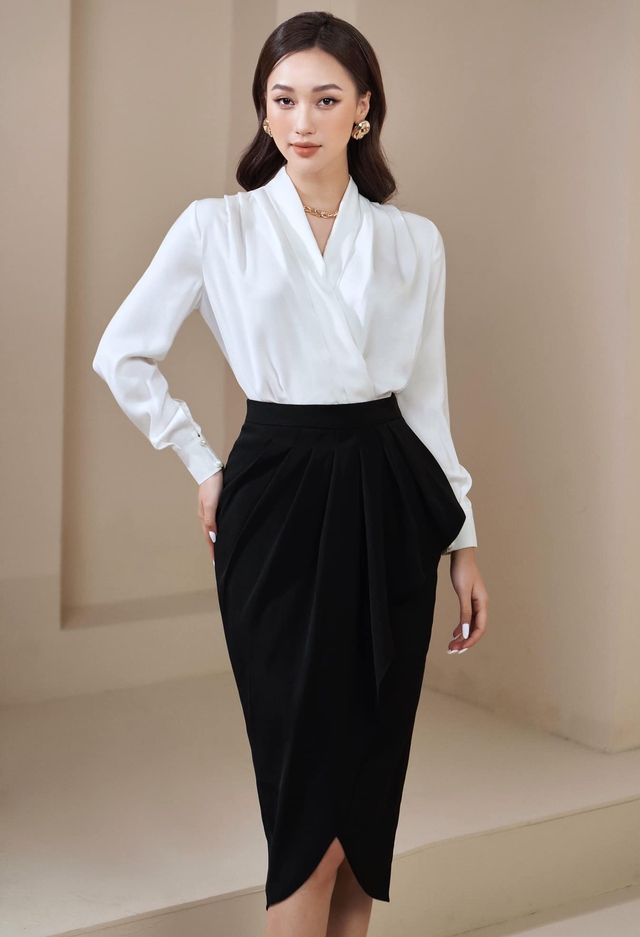RUZA - Áo sơ mi trắng mix với chân váy đen luôn là 2 gam màu chủ đạo với  phong cách thời trang dành cho quý cô công sở. Với thiết kế