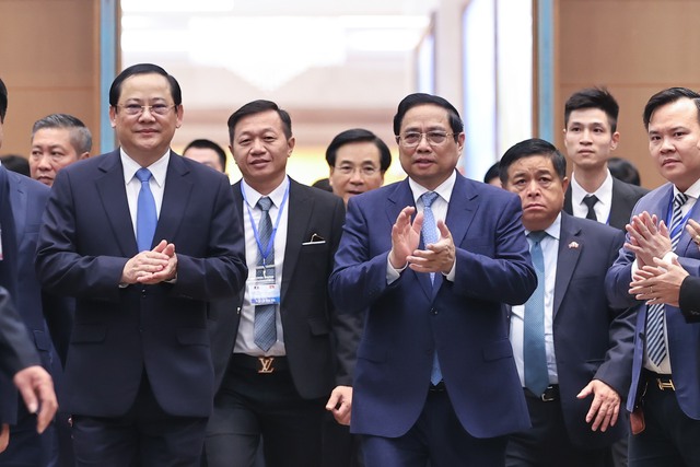 Hai Thủ tướng dự Hội nghị Hợp tác đầu tư Việt - Lào- Ảnh 1.