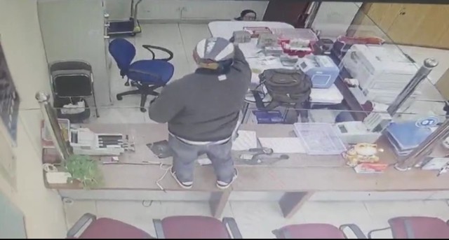 Truy bắt nghi phạm dùng súng cướp ngân hàng ở Lâm Đồng- Ảnh 1.