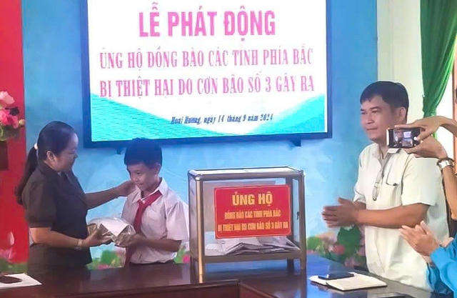 Cậu bé lớp 4 dùng tiền tiết kiệm 3 năm ủng hộ đồng bào vùng lũ miền Bắc- Ảnh 1.