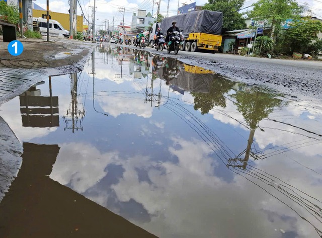 Đường ngập nước, nguy cơ xảy ra tai nạn - Ảnh 1.