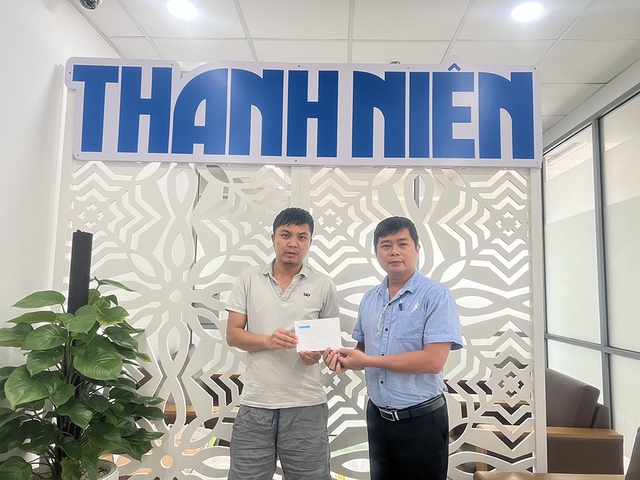 Trao tiền bạn đọc giúp các hoàn cảnh thương tâm - Ảnh 1.