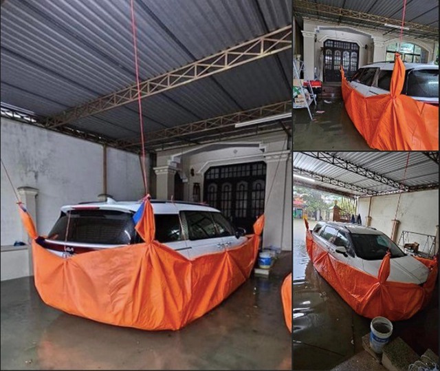 Muôn kiểu bảo vệ ô tô độc lạ của người Việt mùa mưa bão- Ảnh 2.