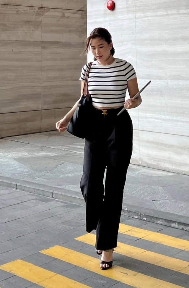 Quần tây xếp ly đang trở lại mạnh mẽ trên đường phố - Ảnh 1.