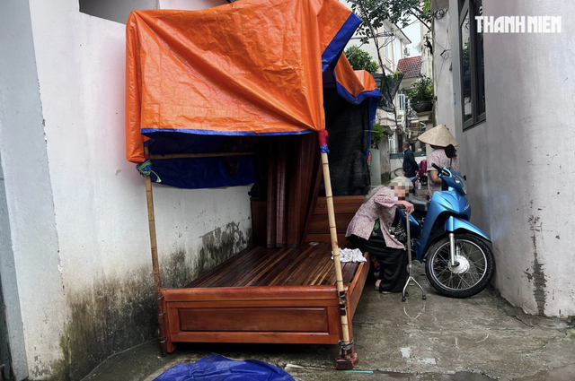 Khởi tố người kê giường chặn lối đi chung ngăn hàng xóm xây nhà trong ngõ - Ảnh 2.