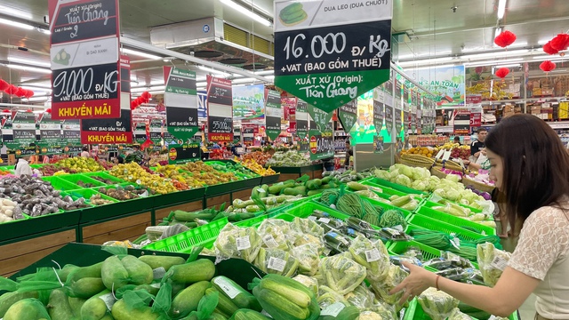 Hết tết, gi&aacute; h&agrave;ng h&oacute;a thiết yếu giảm nhẹ- Ảnh 1.