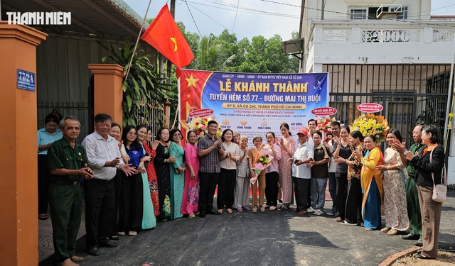 Người dân xã Củ Chi hiến đất làm đường hẻm khang trang để lên phường - Ảnh 1.
