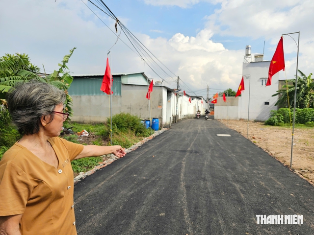 Người dân xã Củ Chi hiến đất làm đường hẻm khang trang để lên phường - Ảnh 2.