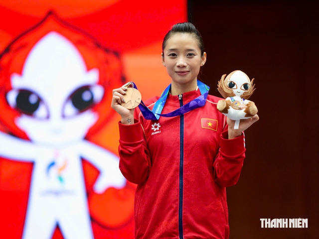 Đằng sau tấm HCĐ quý như vàng của 'nữ hoàng wushu' Dương Thúy Vi: Kỳ ASIAD thứ 4…- Ảnh 1.