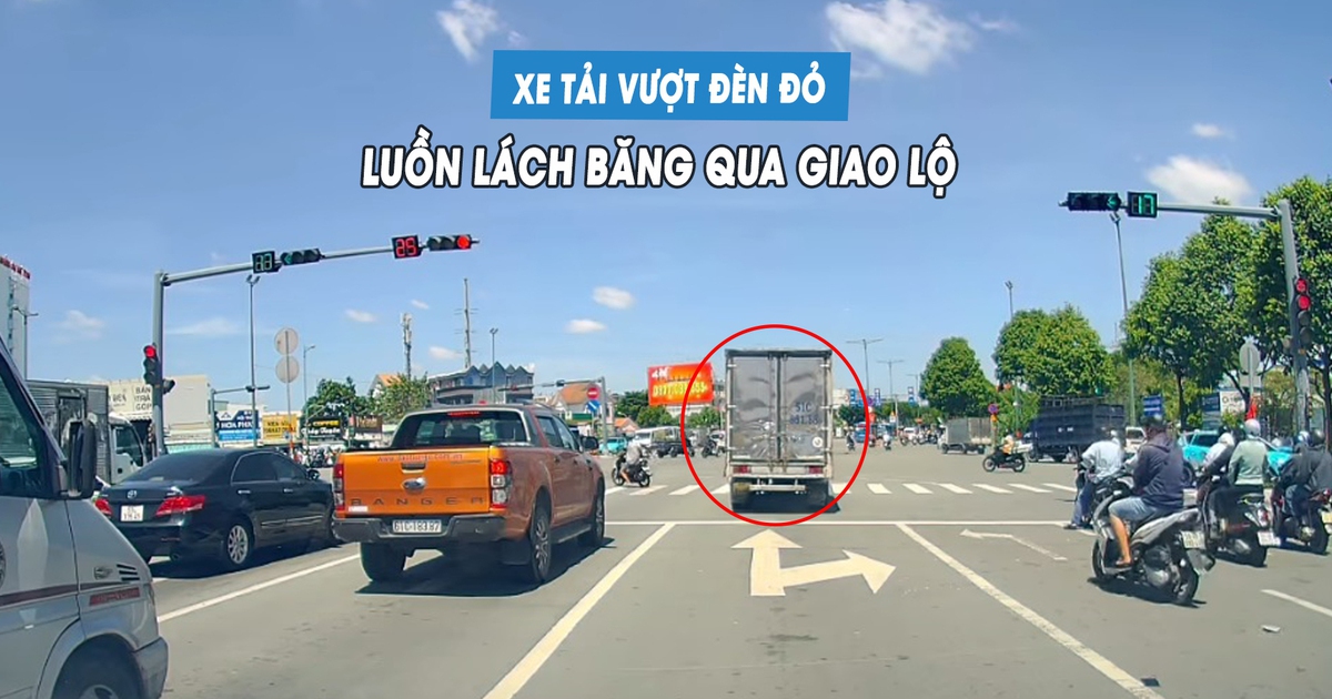 Xe tải ngang nhiên vượt đèn đỏ, luồn lách giữa hàng xe để băng qua giao lộ