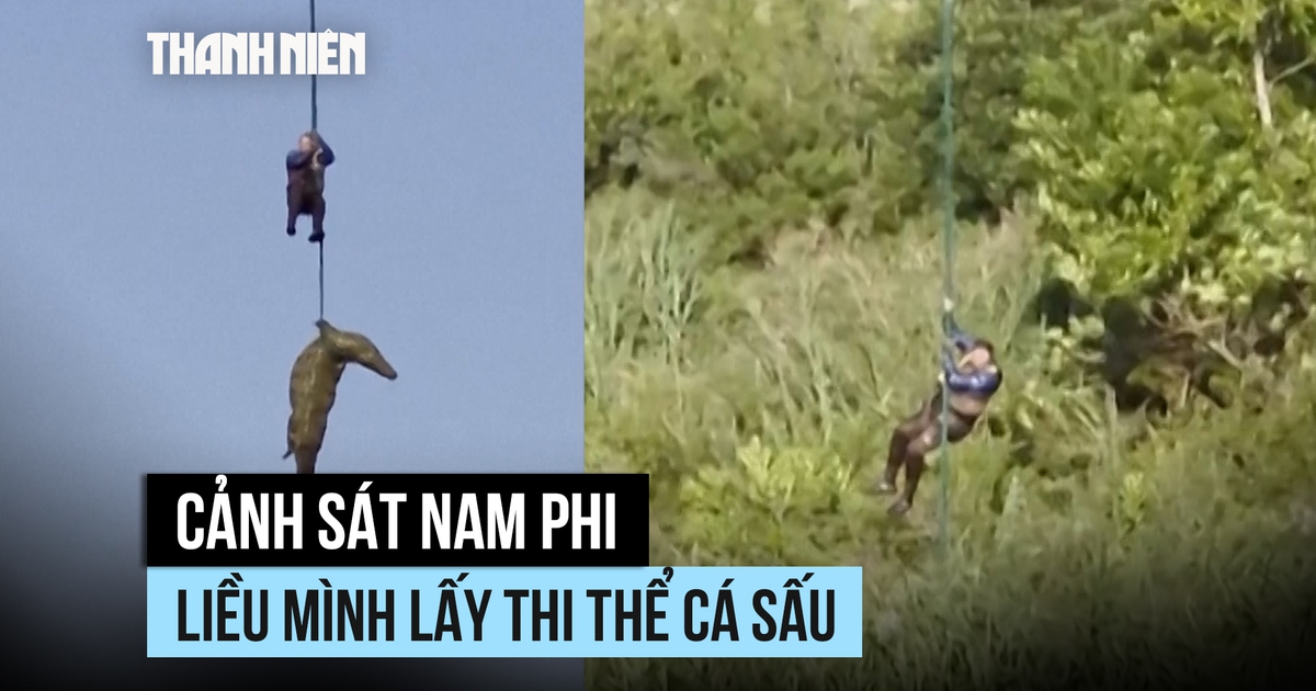Cảnh sát Nam Phi đu dây xuống bắt cá sấu ăn thịt người