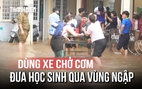 Triều cường vượt báo động 3, giáo viên dùng xe chở cơm đưa học sinh qua vùng ngập