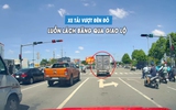 Xe tải ngang nhiên vượt đèn đỏ, luồn lách giữa hàng xe để băng qua giao lộ