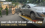 CSGT cẩu ô tô ‘vô chủ’ nằm 4 - 5 năm ở Xóm Chiếu, TP.HCM