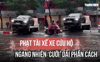 Xe cứu hộ 'cưỡi' dải phân cách giữa phố ngập bị CSGT phạt 5 triệu