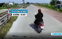 Nữ ‘ninja’ lái xe máy sang đường bị ô tô tông văng: Ai đúng, ai sai?