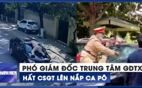 Phó giám đốc trung tâm giáo dục thường xuyên hất CSGT lên nắp ca pô