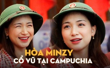 Hòa Minzy đội mũ cối sang Campuchia cổ vũ đội tuyển pencak silat