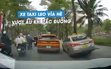 Phẫn nộ tài xế lái xe taxi vượt ẩu, leo lên vỉa hè khi tắc đường