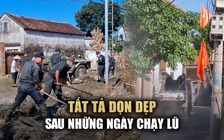 Cảnh sát cơ động cùng dân Hà Nội tất tả dọn dẹp sau những ngày chạy lũ