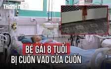 Đu lên cửa cuốn, bé gái 8 tuổi bị cuốn toàn thân