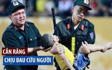 Cảnh sát chịu đau cứu cháu bé không cắn lưỡi ở trận Nam Định - HAGL