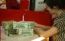 Yêu cầu các ngân hàng xem xét giảm lãi suất cho vay thu mua lúa gạo