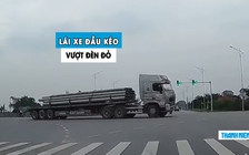 Kinh hoàng xe đầu kéo vượt đèn đỏ, suýt tông ô tô con trên quốc lộ