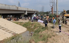 Phát hiện người đàn ông tử vong dưới mương nước cạnh dốc cầu Mỹ Thuận 2