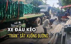 Xe đầu kéo đang chạy gặp sự cố, sắt thép tràn xuống đường