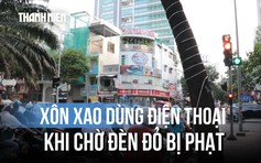 Xôn xao dùng điện thoại khi chờ đèn đỏ bị phạt, Cục CSGT nói gì?