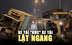 Xe tải 'húc' xe tải: Một lật ngang, một leo dải phân cách