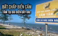 Người dân vô tư tắm tại bãi biển tự phát đầy rác, bất chấp biển cấm
