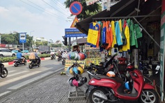 Đồng phục shipper, xe ôm công nghệ bán tràn lan: Mua về mặc có phạm luật?