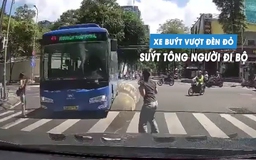 Phẫn nộ xe buýt cố vượt đèn đỏ, suýt tông trúng người đi bộ qua đường